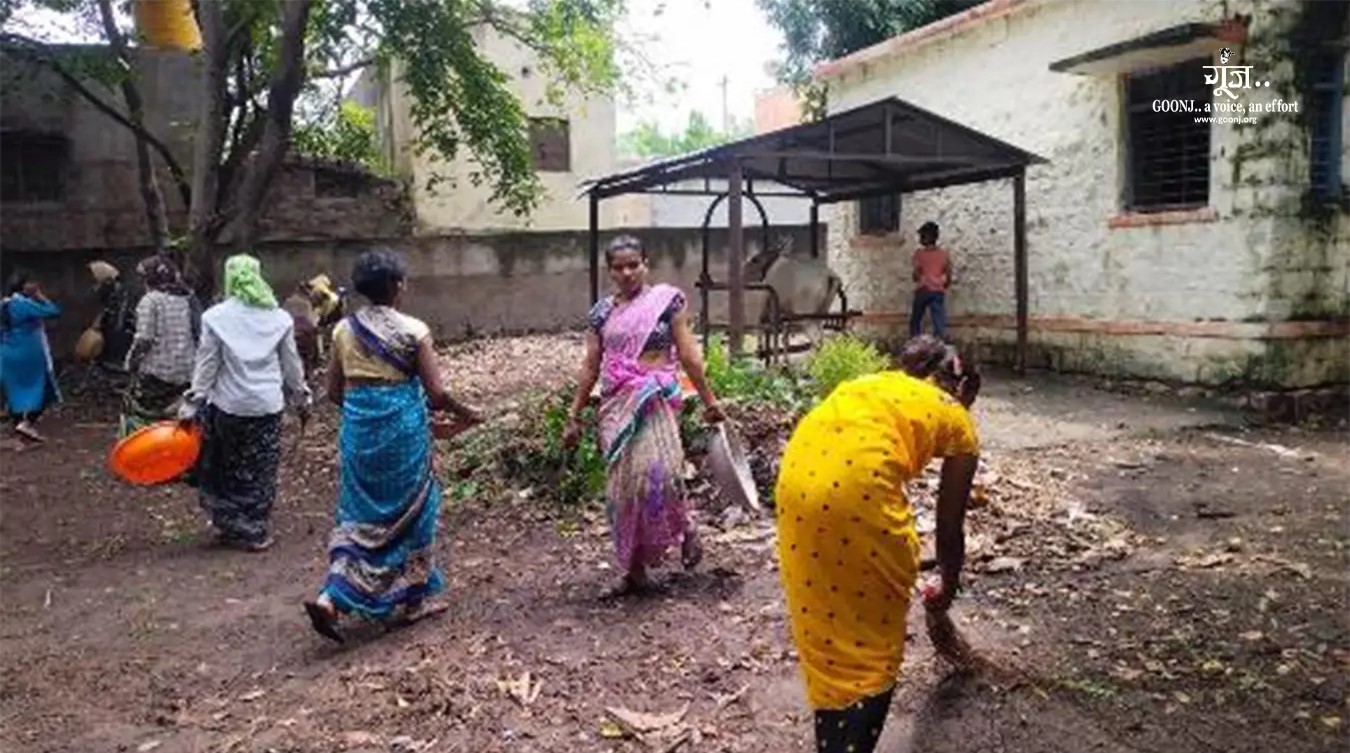  Women and Men Cleaning Around the Health Centre