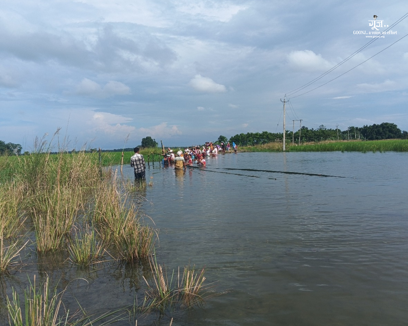 Villagers Crossing Flooded Pathways in Dhemaji During Monsoon