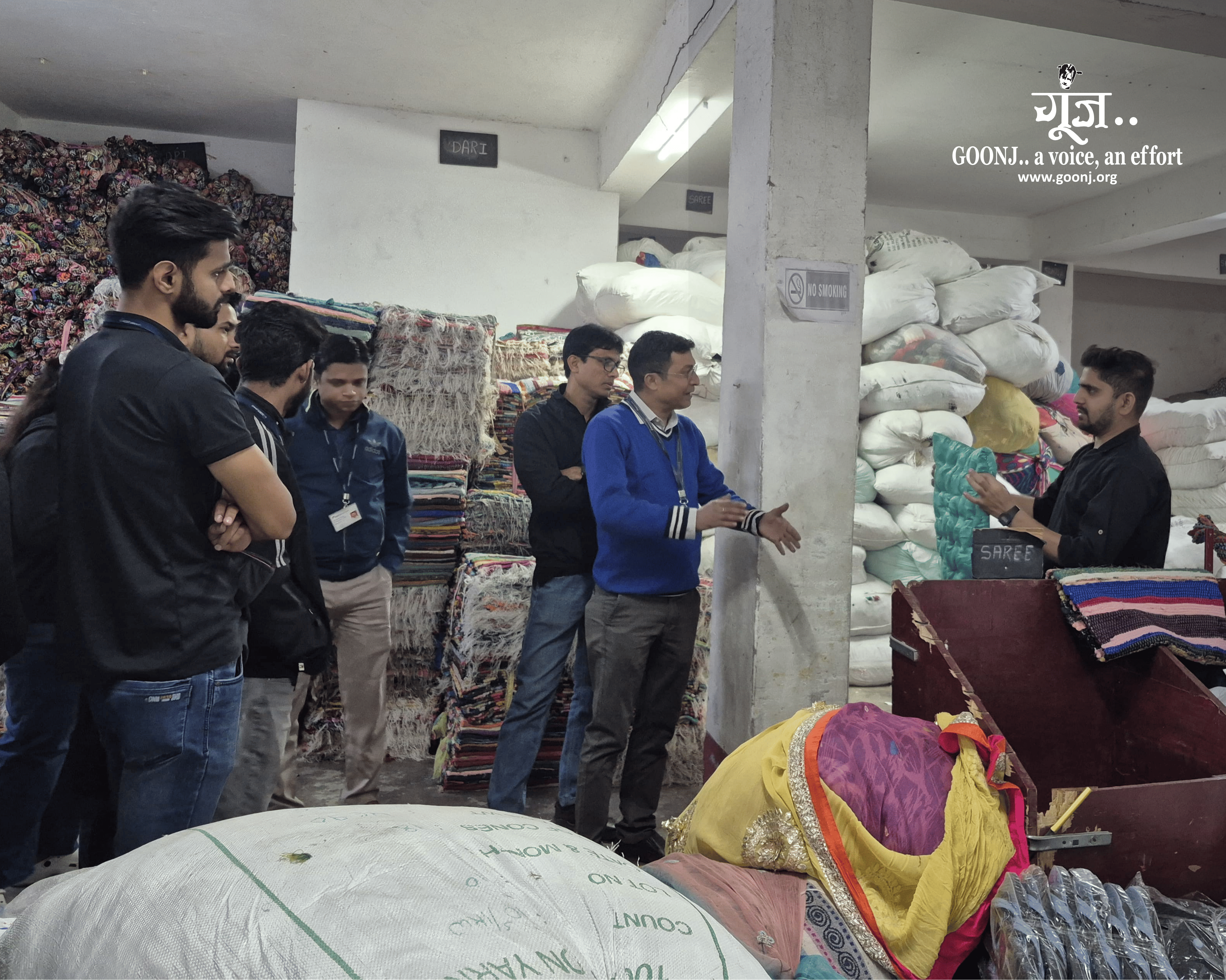 Goonj Team member explaining the volunteers about Cloth For Work initiative