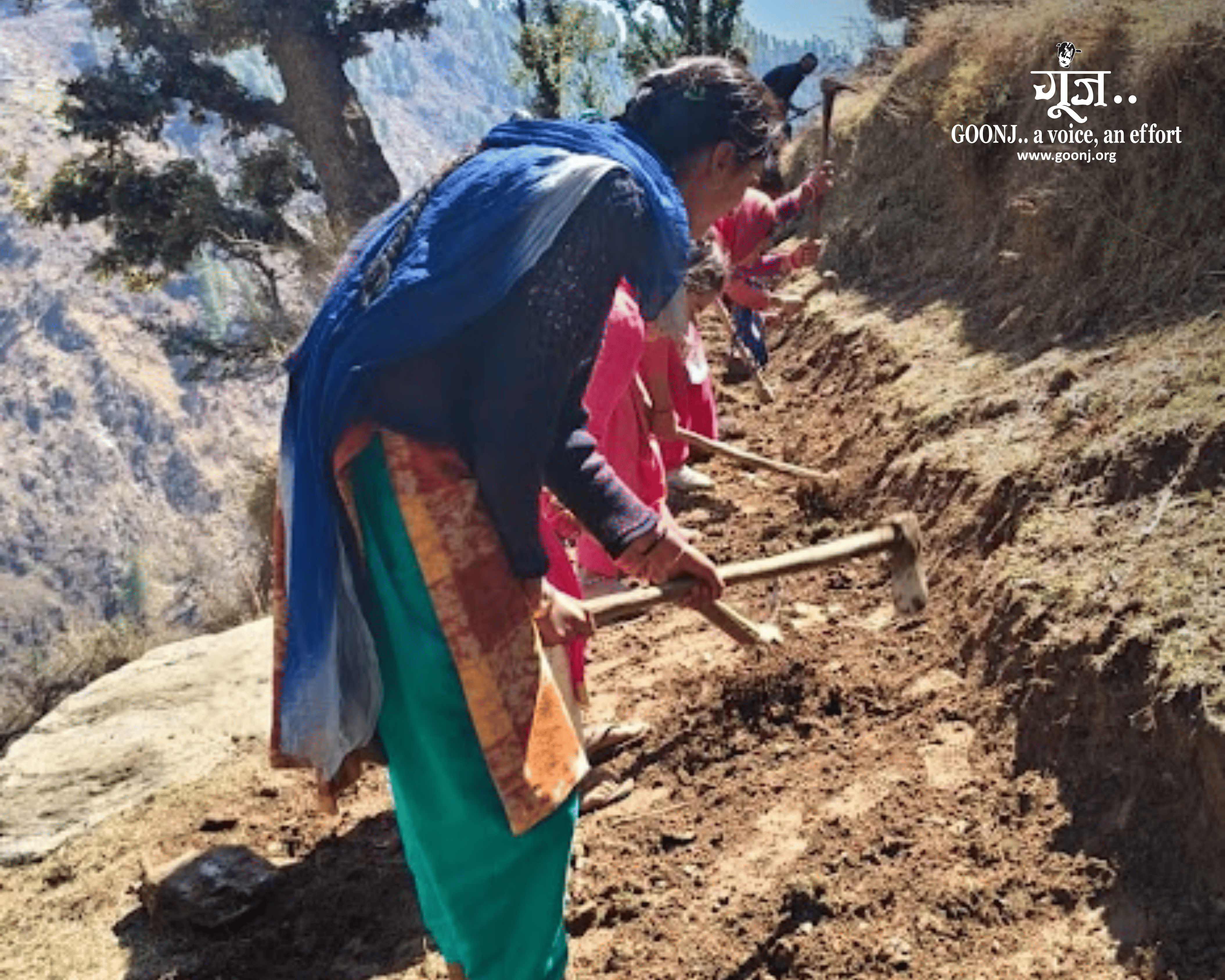 Women work side by side with simple hand tools to level the uneven pathway connecting Chabba to nearby villages.